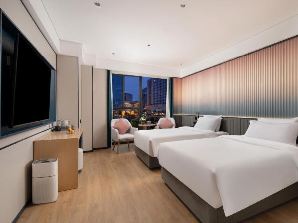 广州番禺万博中心舒与酒店 : photo 1 de la chambre chambre deluxe double ou lits jumeaux