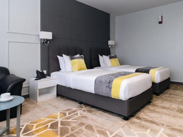 Manhattan Business Hotel, Male : photo 2 de la chambre chambre lits jumeaux standard (navette aéroport aller-retour gratuite et 10 % de réduction sur la nourriture et les boissons)
