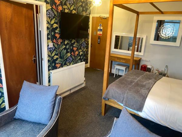 The Fossil Tree Hotel : photo 2 de la chambre chambre double de luxe avec lit à baldaquin - vue sur mer