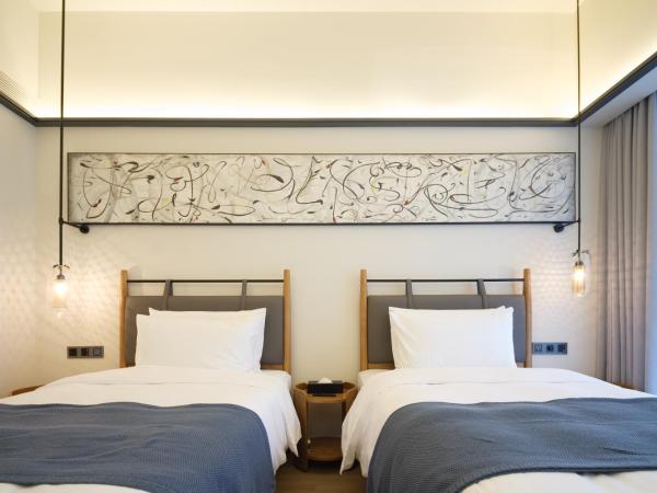 Shanghai T Plus Hotel Residence : photo 3 de la chambre chambre lits jumeaux deluxe