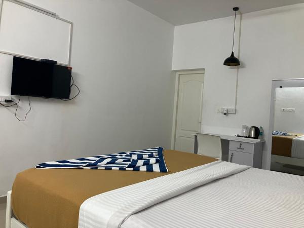 Madras Inn : photo 5 de la chambre chambre triple deluxe