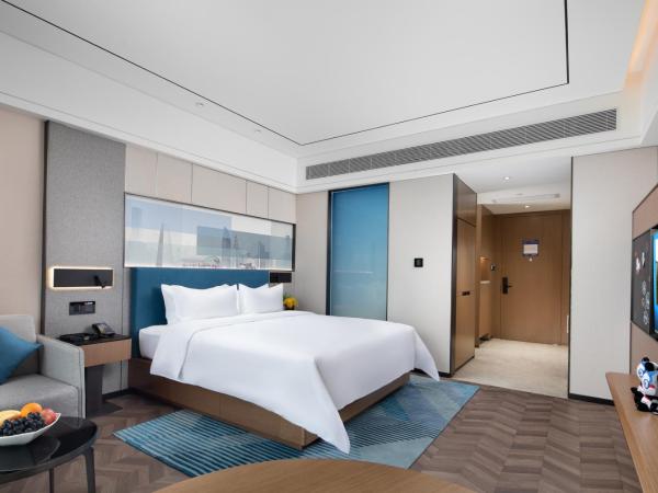 Hampton By Hilton Shenzhen Futian Mangrove Park Apartments : photo 9 de la chambre chambre lit king-size deluxe - vue sur mer
