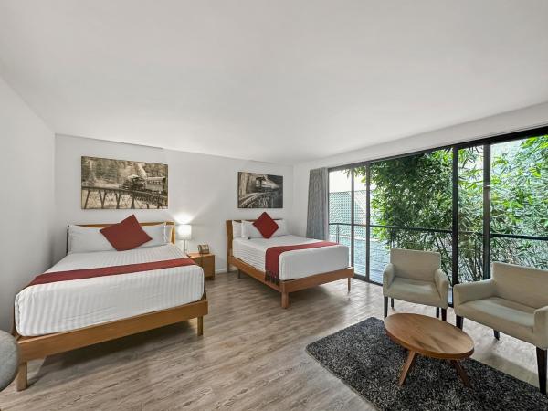 Armonik Suites By Casanevo : photo 5 de la chambre chambre deluxe avec 2 lits doubles