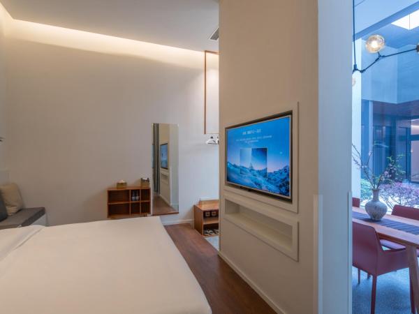 Wuyu Hotel Chongqing Yangjiaping The Mixc : photo 5 de la chambre chambre supérieure lit queen-size