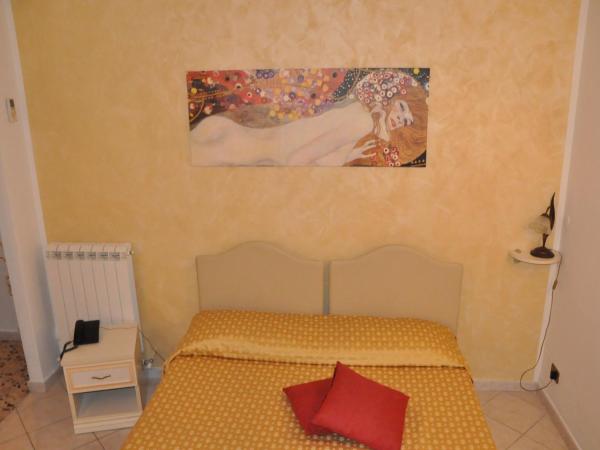 Hotel Vittoriano : photo 1 de la chambre chambre quadruple