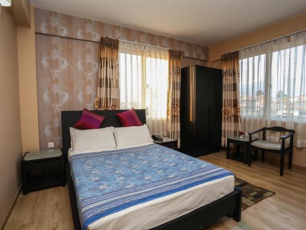 Nirvana Home : photo 8 de la chambre chambre lit king-size avec balcon