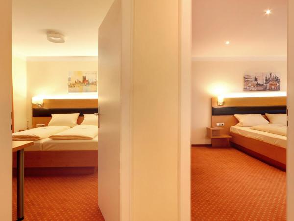 Hotel Kriemhild am Hirschgarten : photo 4 de la chambre suite deluxe avec baignoire spa