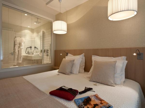 Hotel des Lices : photo 3 de la chambre chambre double ou lits jumeaux deluxe – vue sur jardin