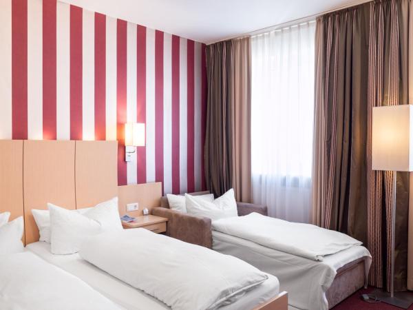 Hotel Deutsches Haus : photo 3 de la chambre chambre triple standard
