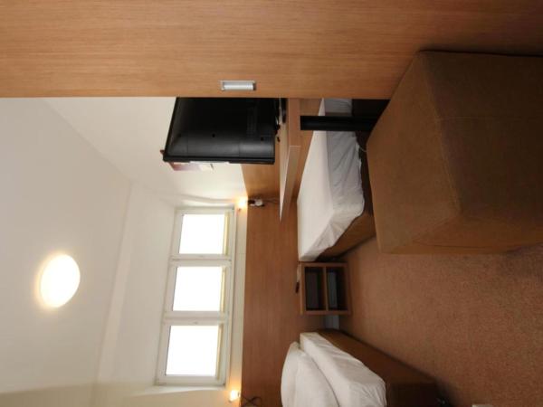 Apartment Hotel am Sand : photo 10 de la chambre chambre simple