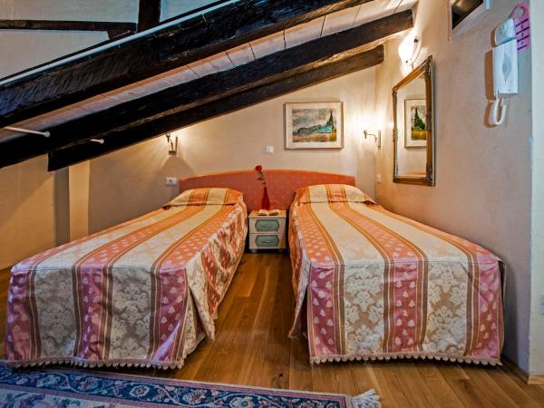 Residence MARCO POLO Centro Storico : photo 1 de la chambre attic double room with kitchenette