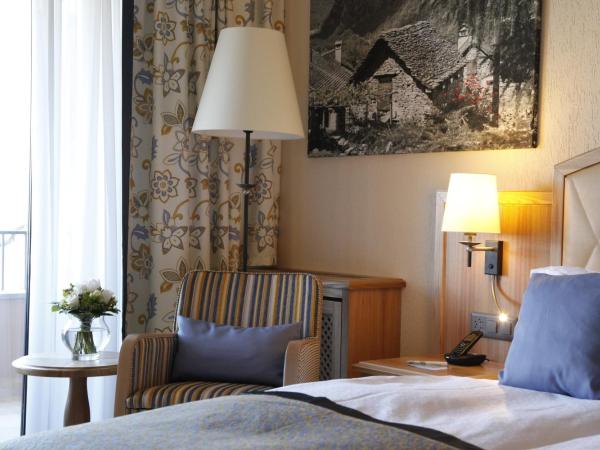 Boutique-HOTEL REMORINO, a Private Selection Hotel : photo 3 de la chambre chambre double confort avec vue partielle sur le lac