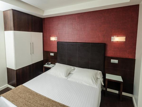 Hotel Alda San Carlos : photo 2 de la chambre grande chambre simple