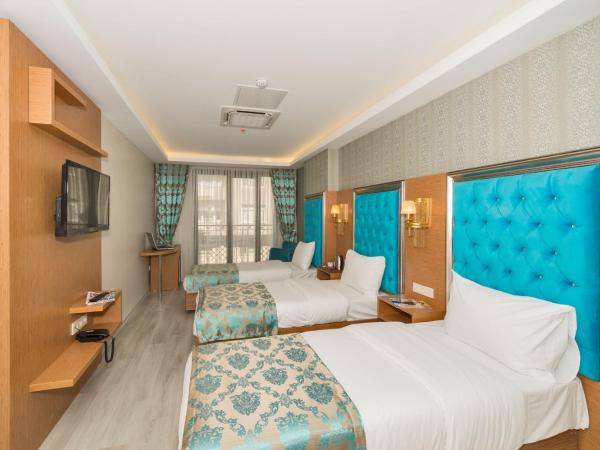 Grand Palace Hotel : photo 6 de la chambre chambre triple deluxe