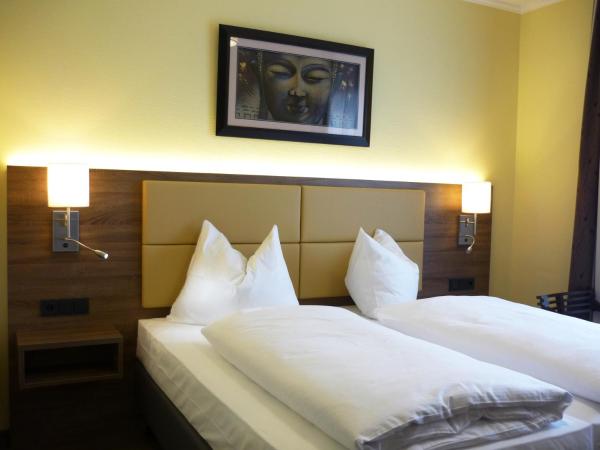Naam Hotel & Apartments Frankfurt City-Messe Airport : photo 2 de la chambre chambre double deluxe