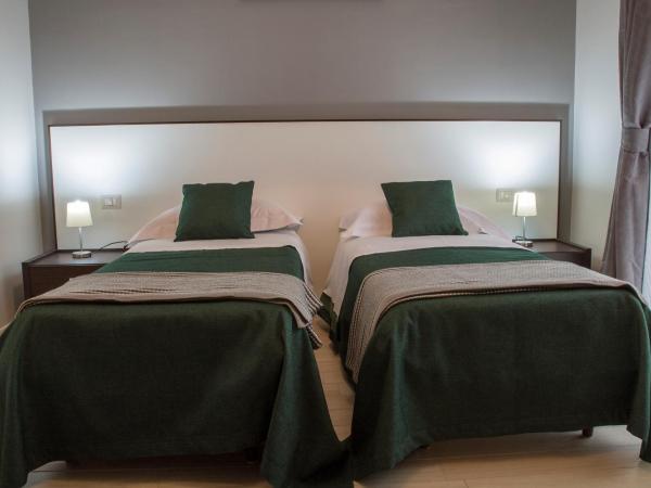 B&B Da Vinci : photo 2 de la chambre chambre lits jumeaux avec lit d’appoint - 301