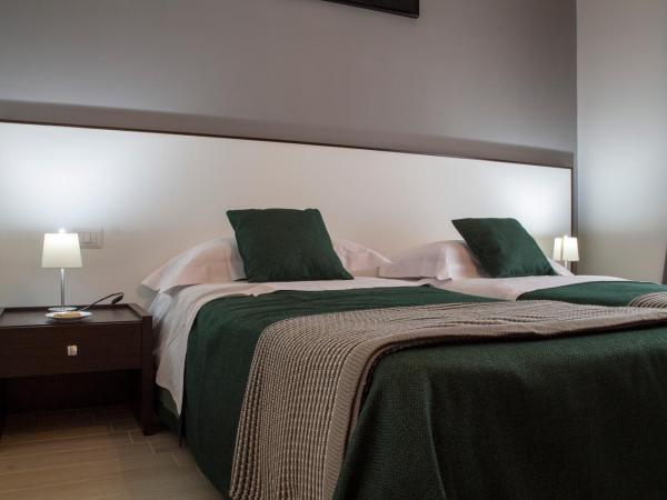 B&B Da Vinci : photo 3 de la chambre chambre lits jumeaux avec lit d’appoint - 301