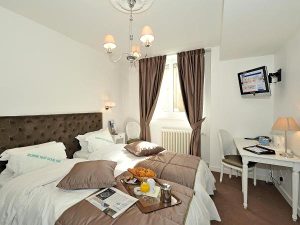 Kyriad Saumur Hyper Centre Hôtel Appartements et SPA soins Sothys Paris : photo 3 de la chambre chambre lits jumeaux confort