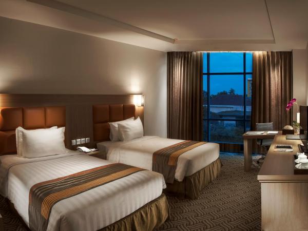 Cavinton Hotel Malioboro Yogyakarta by Tritama Hospitality : photo 1 de la chambre chambre deluxe double ou lits jumeaux