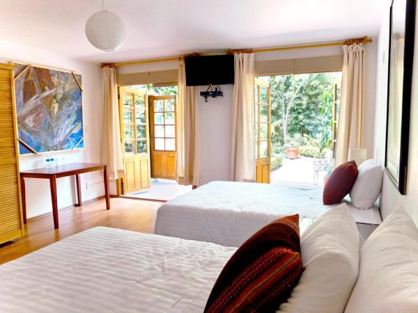 Casa Jacinta Guest House : photo 9 de la chambre chambre double avec 2 lits doubles