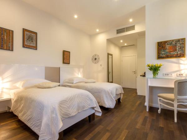 Pellegrini Luxury Rooms : photo 1 de la chambre chambre double ou lits jumeaux deluxe – vue sur jardin