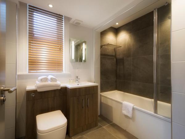 The Orchid Hotel : photo 1 de la chambre hébergement lit king-size classique