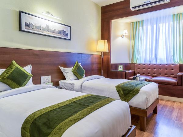 Treebo Premium Grand Emerald : photo 1 de la chambre chambre double standard
