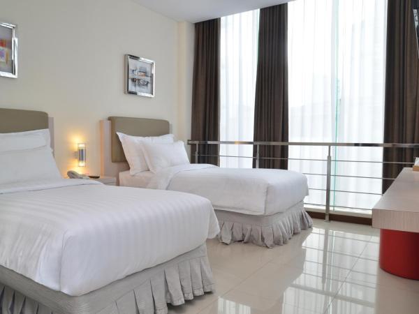 d'primahotel Melawai - Blok M : photo 10 de la chambre chambre deluxe double ou lits jumeaux