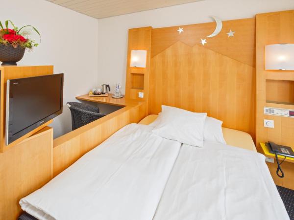 Stella Swiss Quality Hotel : photo 3 de la chambre chambre simple avec petit lit double