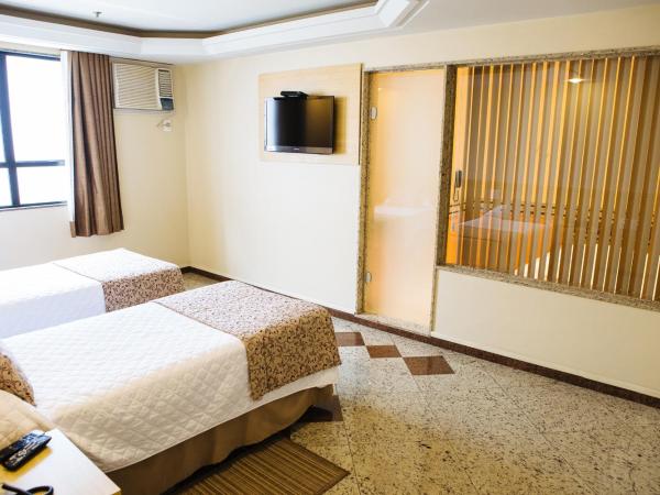 Elegance Praia Hotel : photo 3 de la chambre suite avec jacuzzi