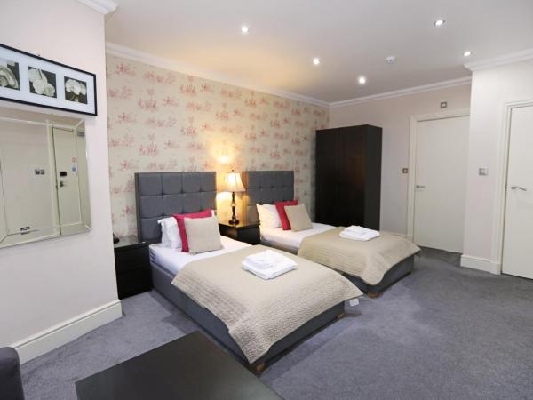 Palmerston Suites : photo 1 de la chambre chambre lits jumeaux deluxe