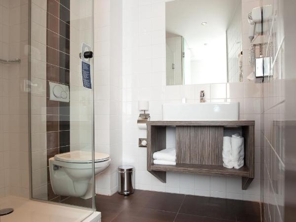 WestCord City Centre Hotel : photo 5 de la chambre chambre triple - vue sur ville