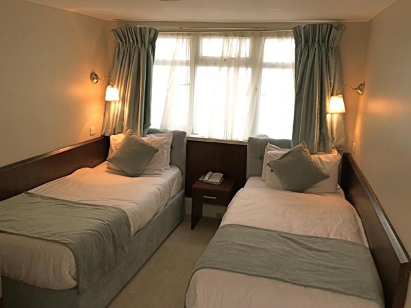 Maples House Hotel : photo 1 de la chambre chambre lits jumeaux