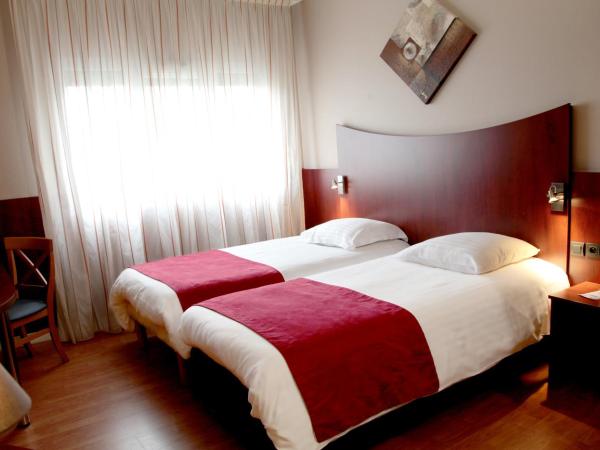 Logis Hotel Center : photo 4 de la chambre chambre lits jumeaux confort