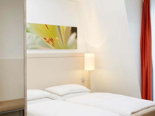 H+ Hotel München : photo 4 de la chambre studio d'affaires