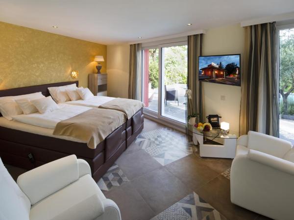 Boutique Hotel Albergo Brione : photo 2 de la chambre chambre double supérieure - vue sur jardin