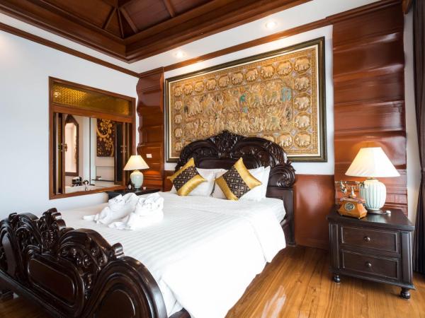 Villa Sirilanna Hotel : photo 5 de la chambre chambre lit king-size de luxe avec baignoire spa et balcon privé