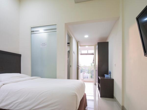 Grand Kebonsari Guesthouse : photo 7 de la chambre chambre lit king-size deluxe