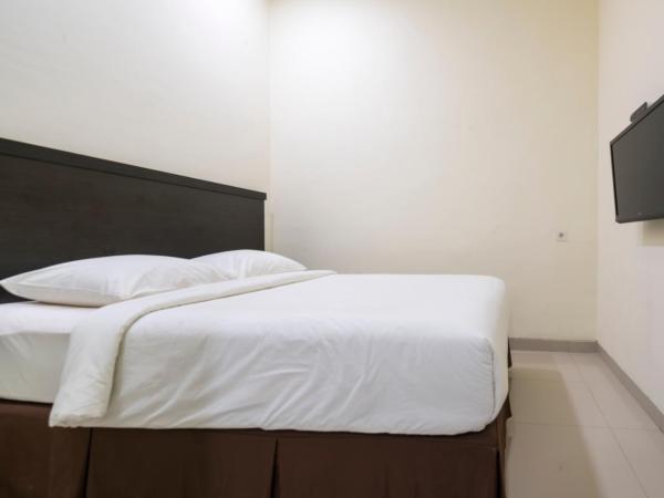 Grand Kebonsari Guesthouse : photo 9 de la chambre chambre lit king-size deluxe