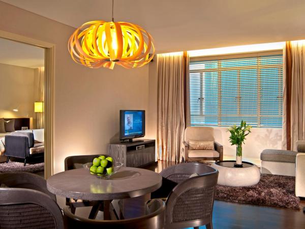 Ascott Raffles Place Singapore : photo 1 de la chambre suite brown
