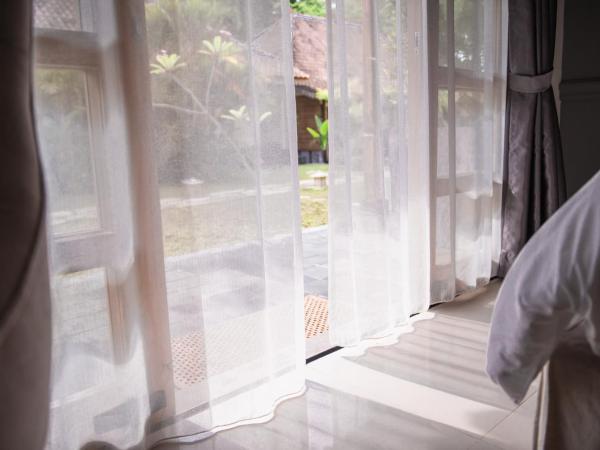 Blue Garden Yogyakarta : photo 7 de la chambre chambre double ou lits jumeaux deluxe – vue sur jardin