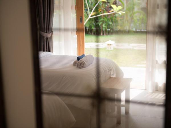 Blue Garden Yogyakarta : photo 6 de la chambre chambre double ou lits jumeaux deluxe – vue sur jardin