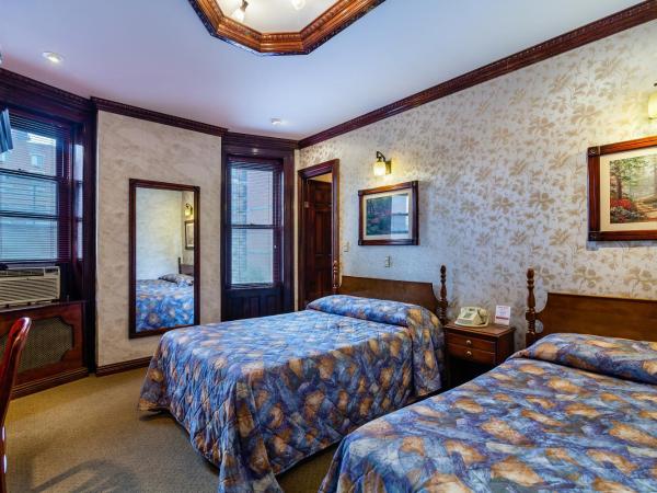Hotel 31 Extended Stay : photo 8 de la chambre chambre double avec 2 lits doubles et salle de bains privative