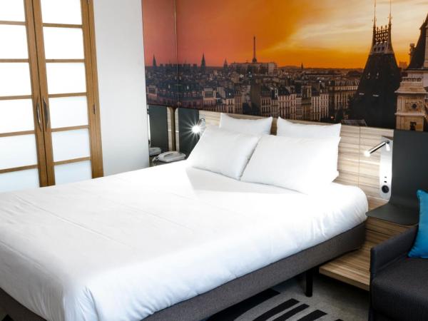 Novotel Paris 14 Porte d'Orléans : photo 9 de la chambre chambre lit queen-size supérieure avec canapé-lit 1 place