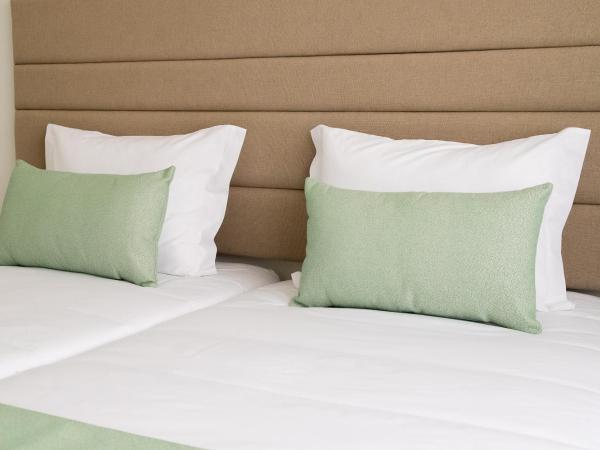 Simon Guest Apartments : photo 10 de la chambre chambre double ou lits jumeaux