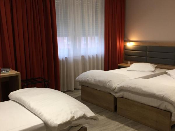 Auberge La Veranda : photo 3 de la chambre chambre triple