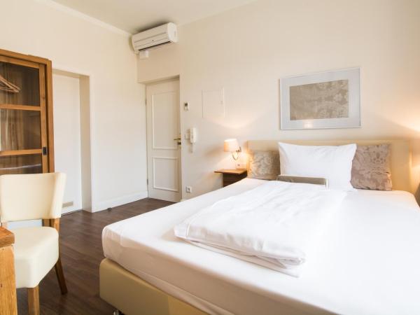 Living am Carlsplatz : photo 1 de la chambre chambre double