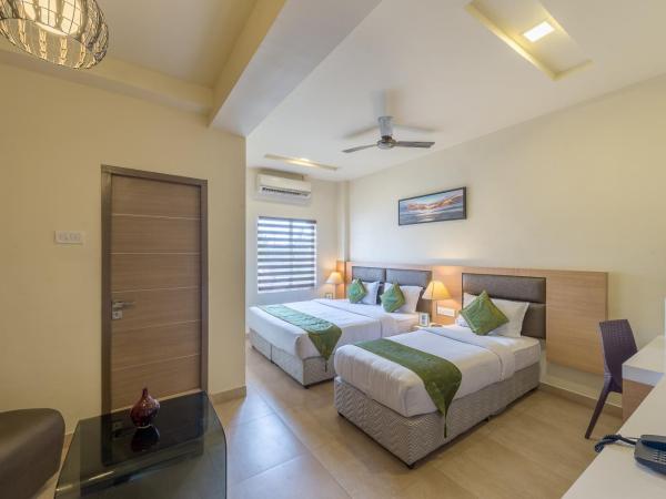 Treebo Nestlay Airport Alandur : photo 3 de la chambre [sanitized] deluxe double room
