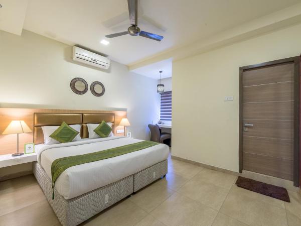 Treebo Nestlay Airport Alandur : photo 1 de la chambre [sanitized] deluxe double room