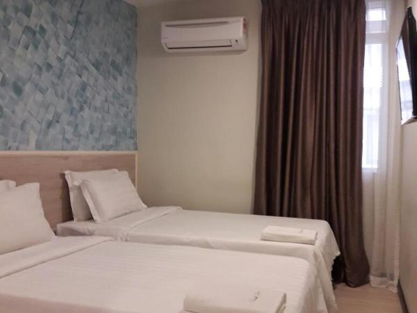 Pantai Inn Kota Kinabalu : photo 1 de la chambre chambre lits jumeaux